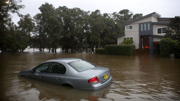 Rising waters inundate Narrabeen Street, Narrabeen.