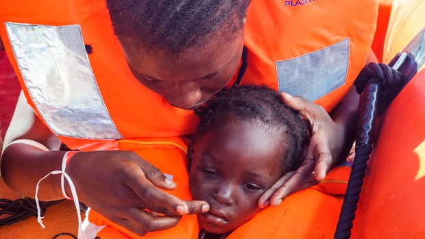 Sara Traore, a two-year old girl from Ivory Coast, is rescued from a rubber boat sailing out of control about 24 kilometres north of Al Khums, Libya.