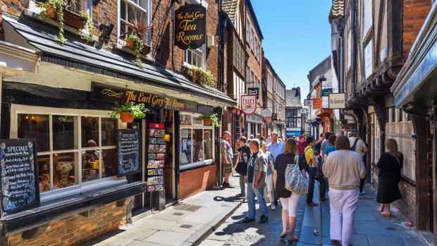 Pubs, shops and cafes on the historic Shambles, York, North Yorkshire, England.
