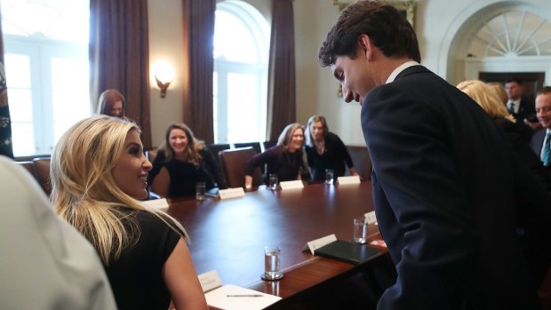 Eyes for him only ... Ivanka Trump and Justin Trudeau.