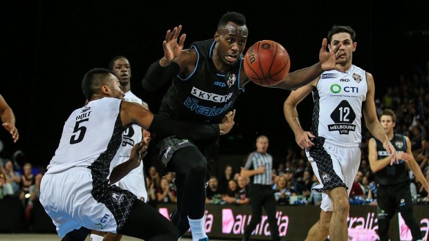 Ouch: Cedric Jackson of the Breakers is fouled during his side’s win over Melbourne United. 