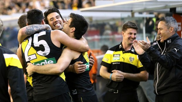 Alex Rance is embraced by teammates after Richmond's preliminary final win.