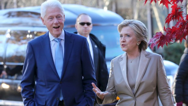 Hillary Clinton and her husband former president Bill Clinton talk after voting in Chappaqua, New York, on election day.