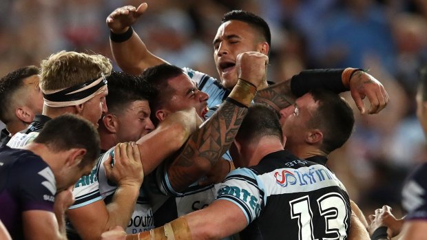 Sweet victory: Sharks players celebrate after the final whistle.