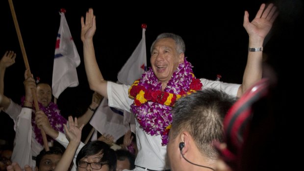 Singapore's Prime Minister Lee Hsien Loong, of the ruling People's Action Party, celebrates his win in Singapore on Saturday. 