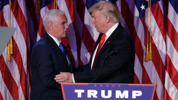 President-elect Donald Trump, right, shakes hands with Vice-President-elect Mike Pence during his victory party.