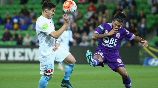 Bruno Fornaroli of Melbourne City is challenged by Jacob Collard of Perth Glory.