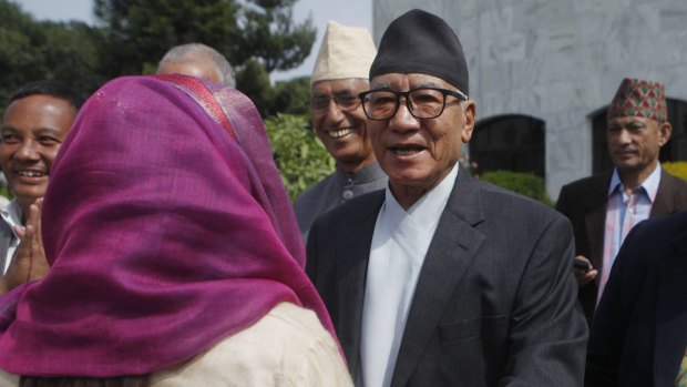 Kul Bahadur Gurung, centre, presidential candidate and leader of Nepali Congress party  arrives to cast his vote for a new president in Kathmandu on Wednesday.