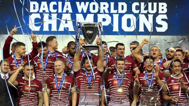World champions: Wigan celebrate the famous victory over the Sharks earlier this year.