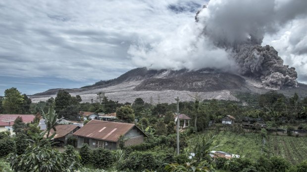 Mount Sinabung spews ash as seen from the nearest village in Karo district, North Sumatra.