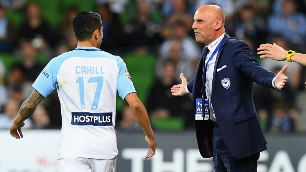 Victory coach Kevin Muscat exchanges words with City star Tim Cahill after the controversial decision.