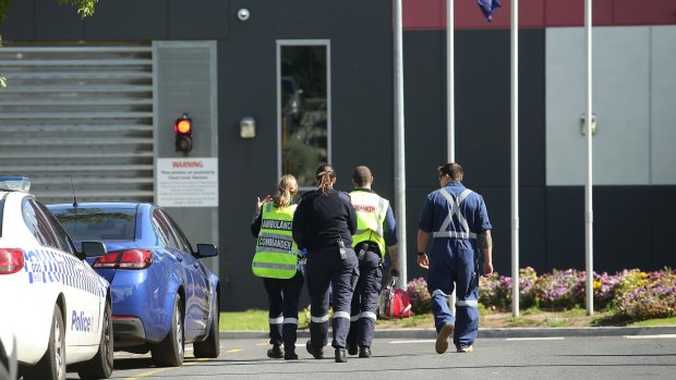 Paramedics enter the Melbourne Youth Justice Centre in Parkville on November 14, 2016, after riots. 