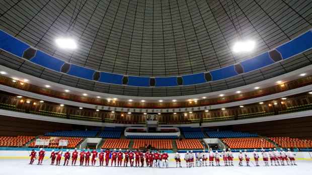 Taesongsan and Pyongyang Choldo teams line up after a game at the Pyongyang Ice Rink.