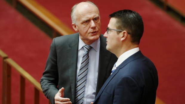 Eric Abetz and Zed Seselja in discussions in the Senate this week.