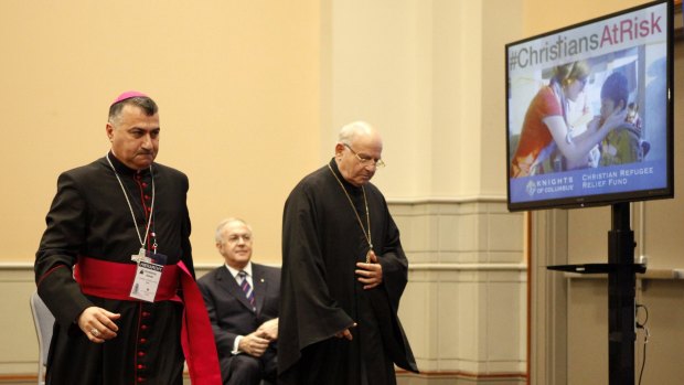 Archbishop Bashar Matti Warda, of Erbil, Iraq, left, and Archbishop Jean-Clement Jeanbart, of Aleppo, Syria, speak at a news conference on Tuesday about the plight of persecuted Middle Eastern Christians.