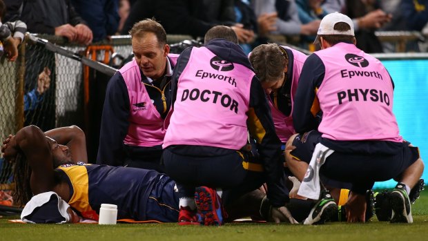 Medical staff attend to Naitanui.