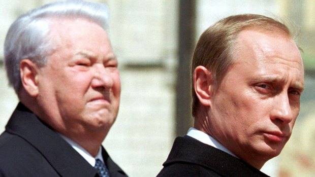 The late Russian president Boris Yeltsin, left, stands with President Vladimir Putin in Moscow in 2000.