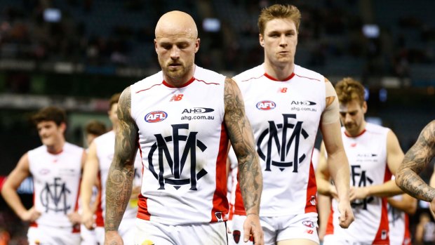 Dee-feated again: Nathan Jones leads Melbourne off the ground on Sunday.