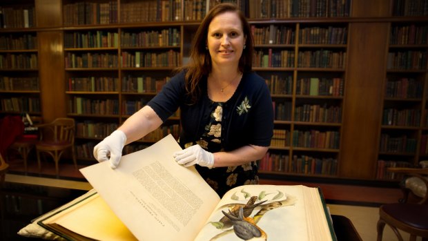 Author Melissa Ashley at Sydney's Mitchell Library with the illustrations by Elizabeth Gould in <i>The Birds of Australia</i> that inspired her novel. 
