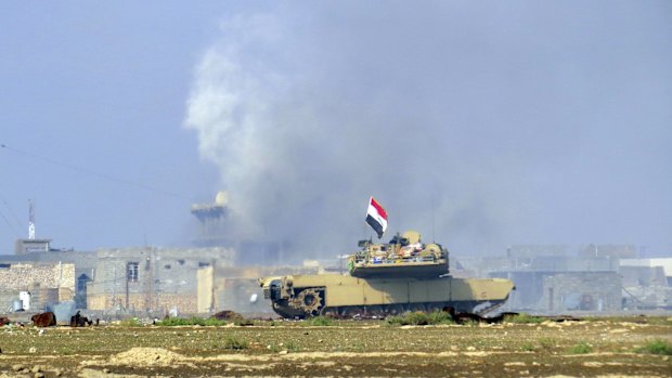 An Iraqi Army tank confronts Islamic State fighters in Ramadi, Iraq, last month.