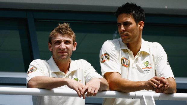 Mates: Hughes and Johnson of Australia look on from the balcony  during day one of the first Ashes Test in Cardiff in 2009.