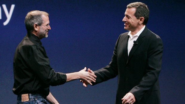 The late Apple Computer CEO Steve Jobs (left) with Disney CEO Bob Iger.