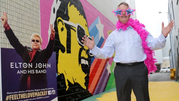 Mackay Mayor Greg Williamson dressed up in classic Elton John wardrobe pieces at Mackay City Centre's Yellow Brick Road.