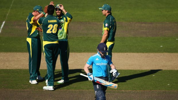 Ducking the issue: Eoin Morgan of England walks after being dismissed by Gurinder Sandhu.