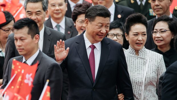 Chinese President Xi Jinping with first lady Peng Liyuan at Hong Kong International Airport on Thursday.