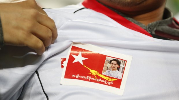 A Myanmar soccer fan shows  a picture of Myanmar opposition leader Aung San Suu Kyi during the country's 2018 FIFA World Cup qualifying match against South Korea on Thursday.