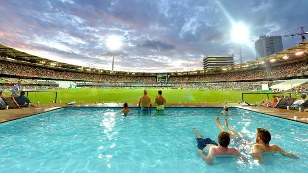 The time slot works: Fans watch the cricket from the pool as the sun sets during day two at the Gabba.