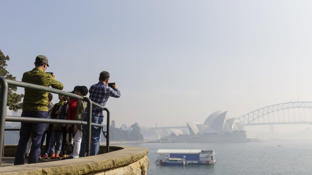Thick smoke blankets Sydney Harbour.