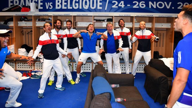 French captain Yannick Noah (left) and his team celebrate their victory.
