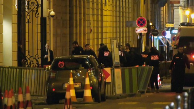 French police attend the scene outside the Ritz in Paris after a robbery Wednesday evening.