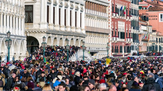 The overcrowded waterfront of Riva degli Schiavoni in Venice.