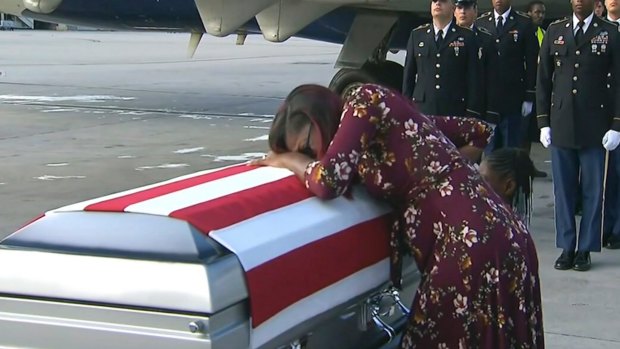 Myeshia Johnson cries over the casket of her husband Sergeant La David Johnson.