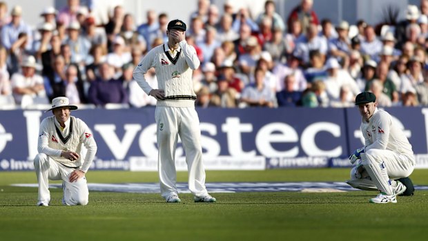 Australia's Michael Clarke, Adam Voges and Peter Nevill look dejected.