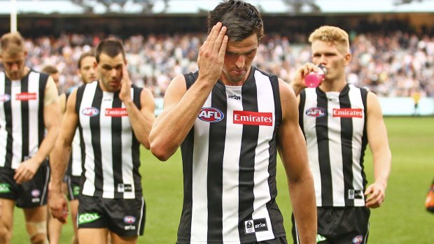 Cold Pies: Scott Pendlebury leads his team off after their loss to arch rival Carlton.