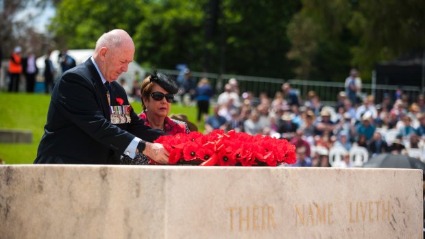 Governor-General Sir Peter Cosgrove lays a wreath on the Stone of Remembrance with his wife Lady Lynne Cosgrove.