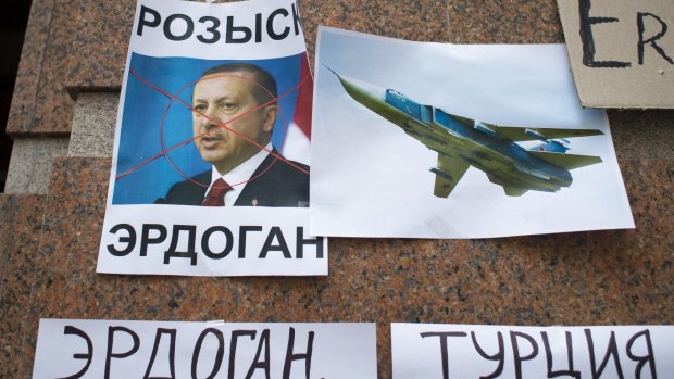Russian anger: posters showing a portrait of Turkish President Recep Tayyip Erdogan that read "Wanted Erdogan", "Erdogan" and "Turkey" after a protest at the Turkish embassy in Moscow.