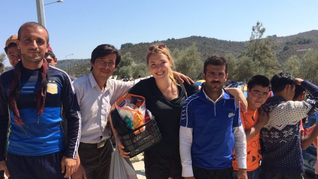 Australian volunteer, Sophie Parr, 23, with refugees on the Greek island of Lesbos. 