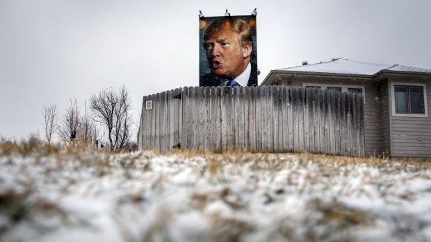 A poster of Donald Trump outside a home in West Des Moines, Iowa, on Monday.
