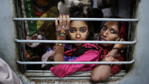 "Everything in India just seems more. Louder. Brighter. Busier." And more unequal, writes Ruby Hamad. Here, West Bengalis leave Delhi by train. 