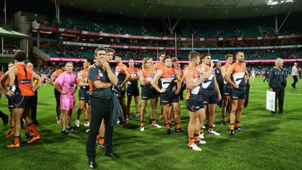 Food for thought: GWS coach Leon Cameron and Giants players after the loss to the Swans at the SCG.
