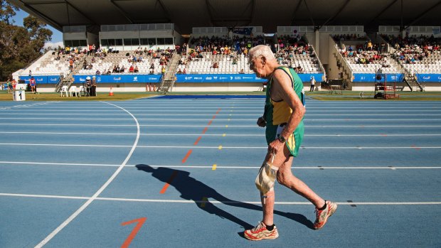 Australian John Gilmour, 97, runs in the 800 meter event -- he was the only competitor in the 90 to 95 age group -- at the World Masters Athletics Championships in Perth.