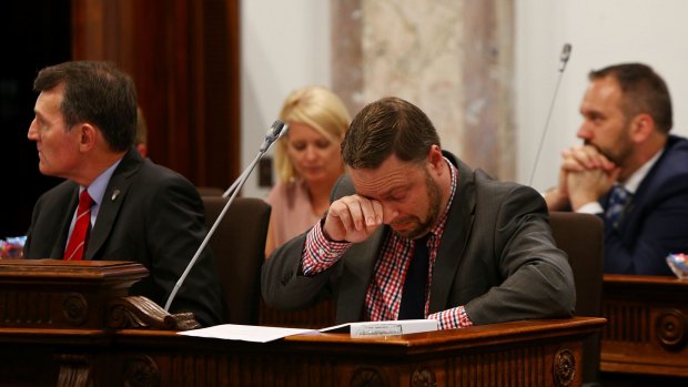 Deputy Mayor Adrian Schrinner wipes away tears after his speech during a 'Condolence Motion' for Manmeet Sharma.