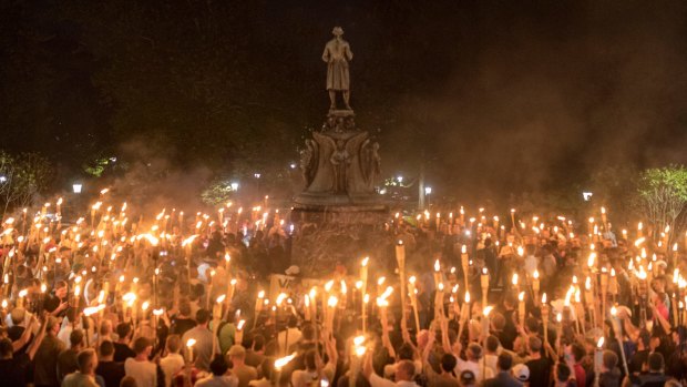 Torch-bearing white nationalists rally around a statue of Thomas Jefferson near the University of Virginia campus in Charlottesville.