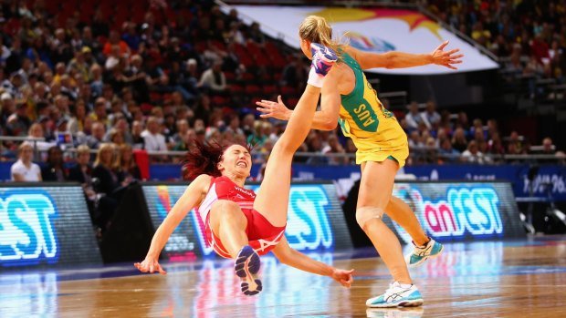Hitting the deck: Jade Clarke of England falls after clashing with Laura Geitz.