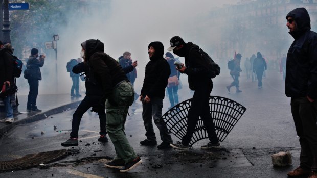 Demonstrators clash with riot police during a protest in Paris.