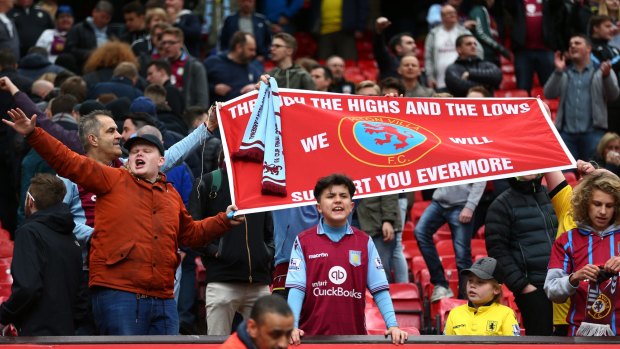 Passion: Aston Villa fans react after their team was relegated.